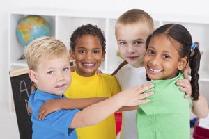 happy preschool kids hugging